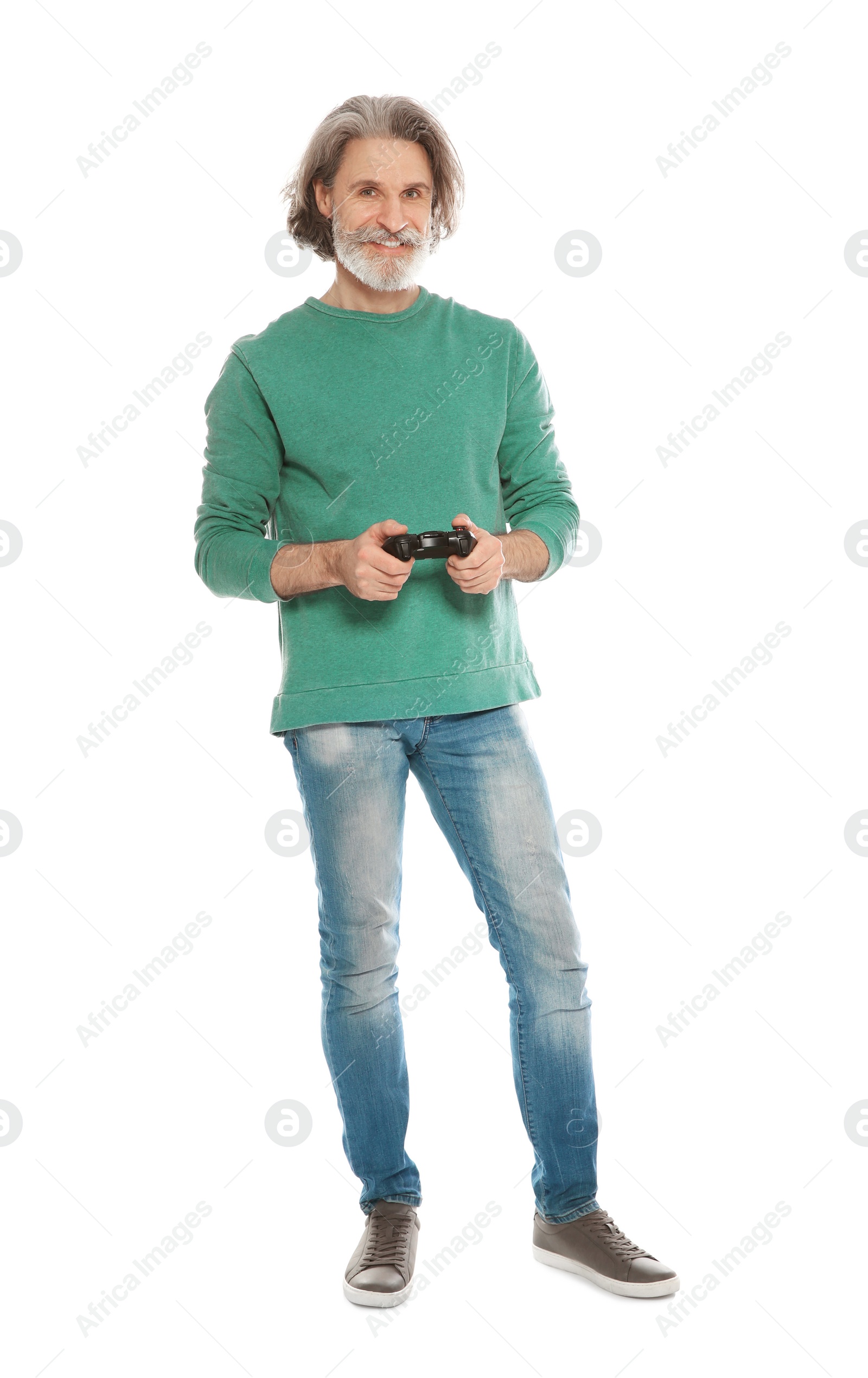 Photo of Emotional mature man playing video games with controller isolated on white