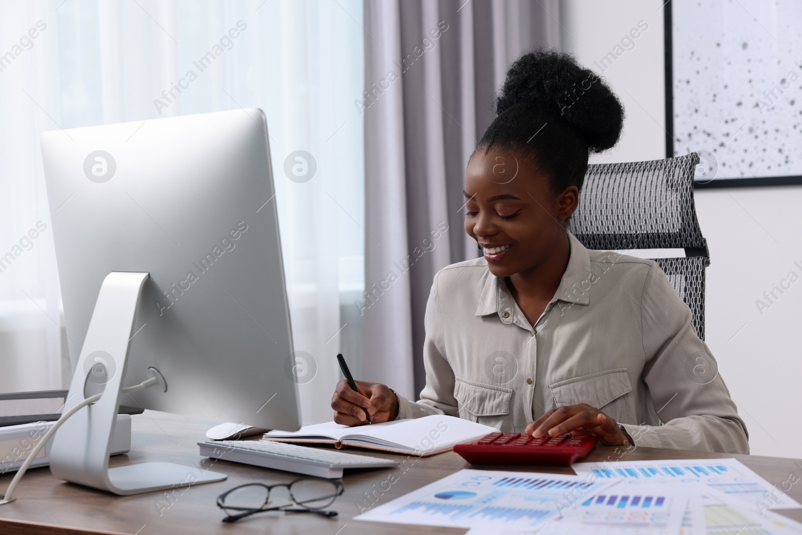 Photo of Professional accountant working at wooden desk in office