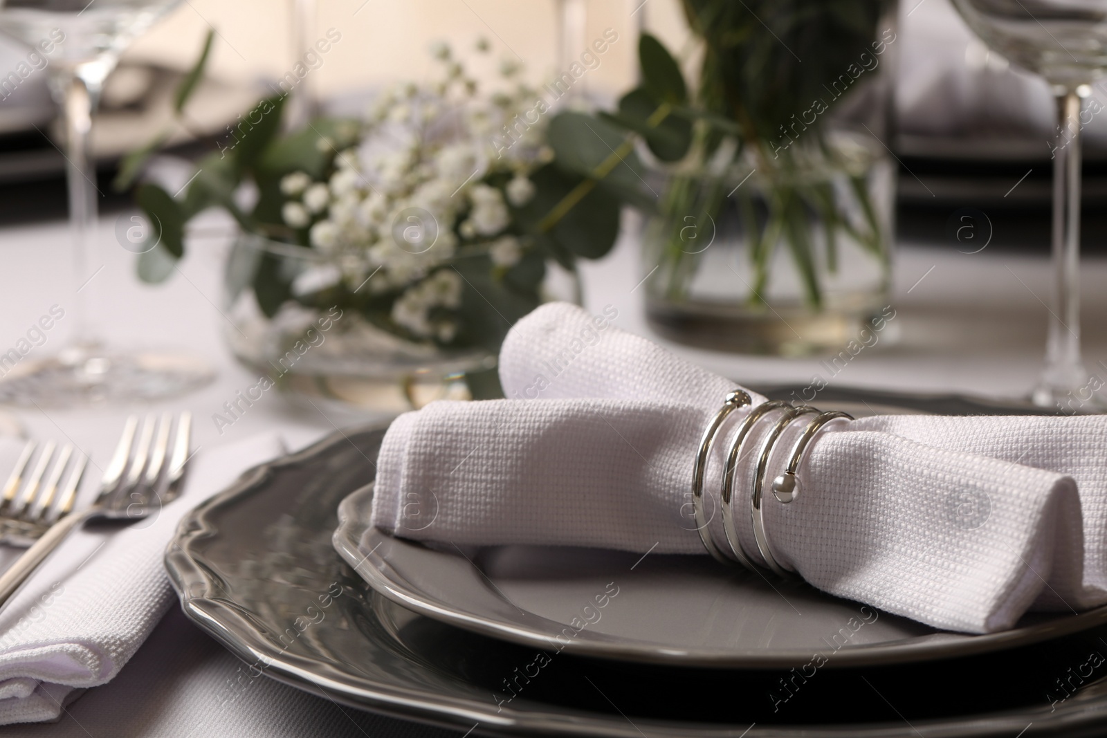 Photo of Stylish elegant table setting for festive dinner in restaurant