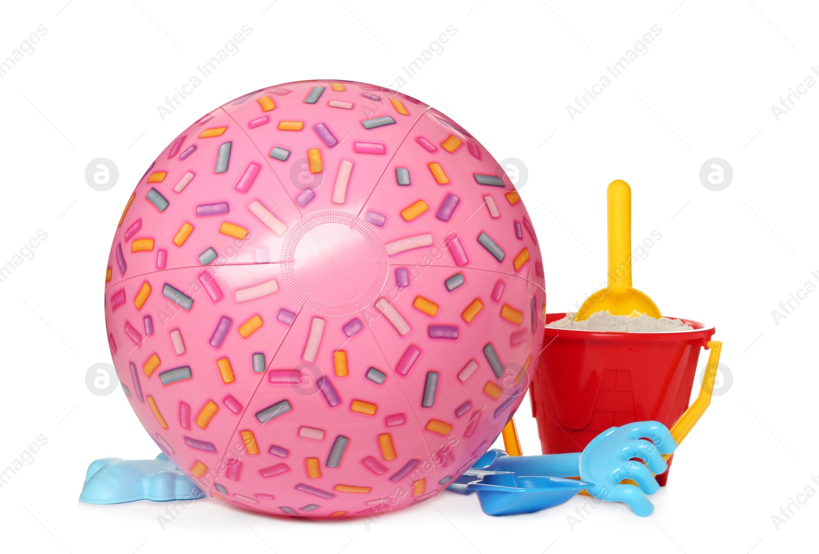 Photo of Inflatable pink beach ball and child plastic toys on white background