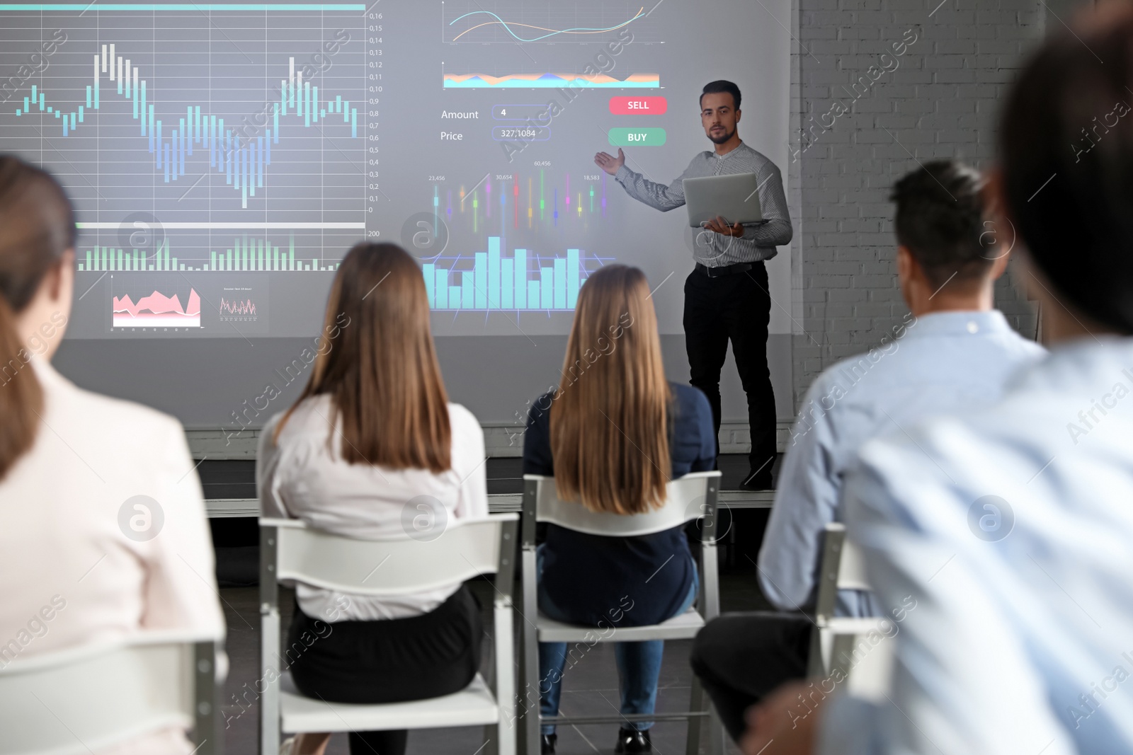 Image of Business people having meeting in office and financial charts on projection screen. Forex conference  