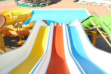 View from colorful slide in water park on sunny day