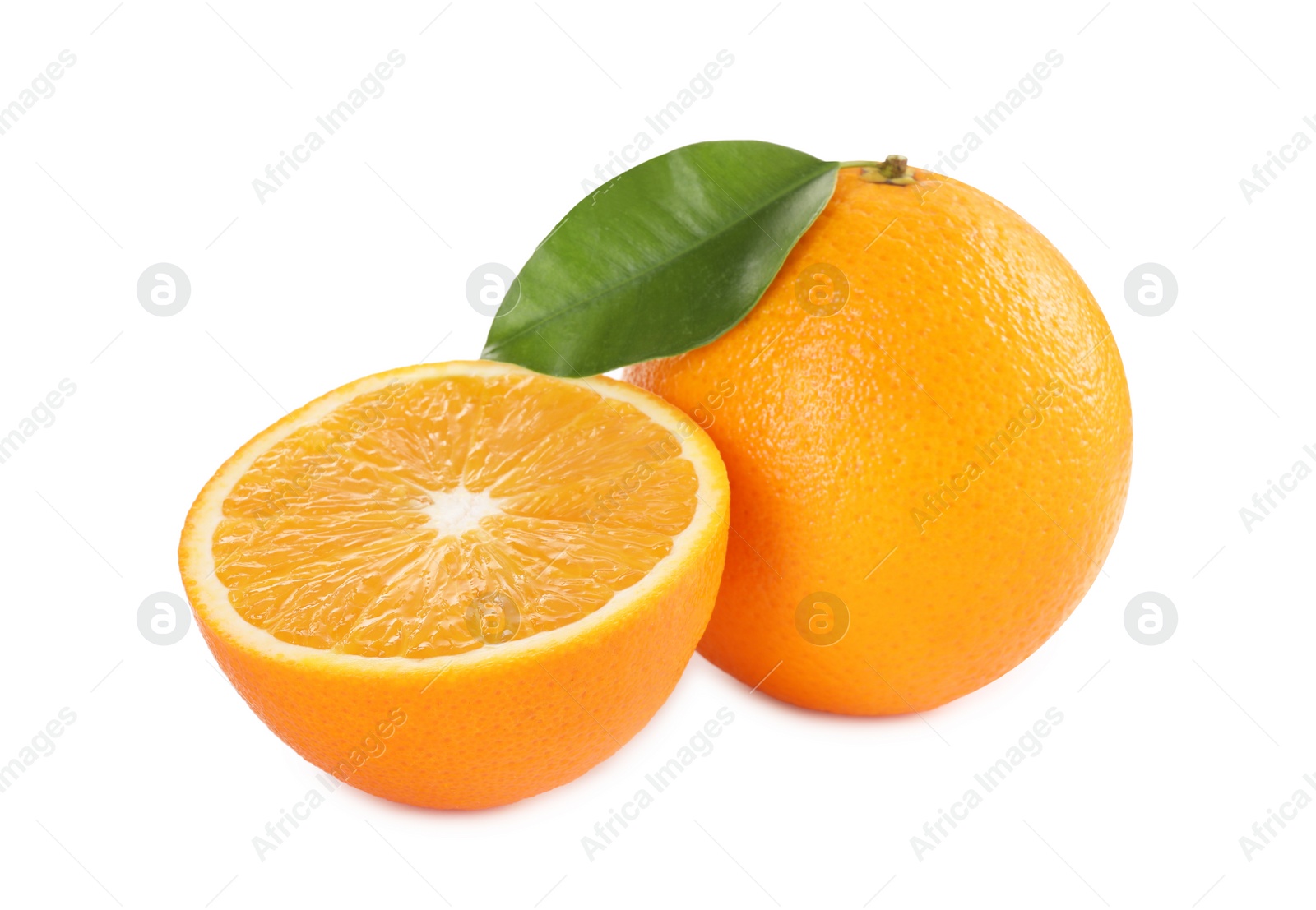 Photo of Whole and cut ripe oranges isolated on white