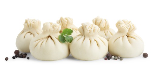 Photo of Uncooked khinkali (dumplings) and spices isolated on white. Georgian cuisine