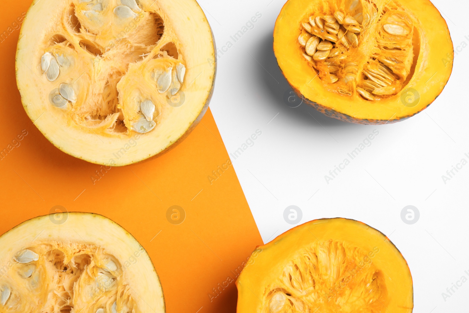 Photo of Fresh ripe pumpkins on color background, flat lay. Holiday decoration