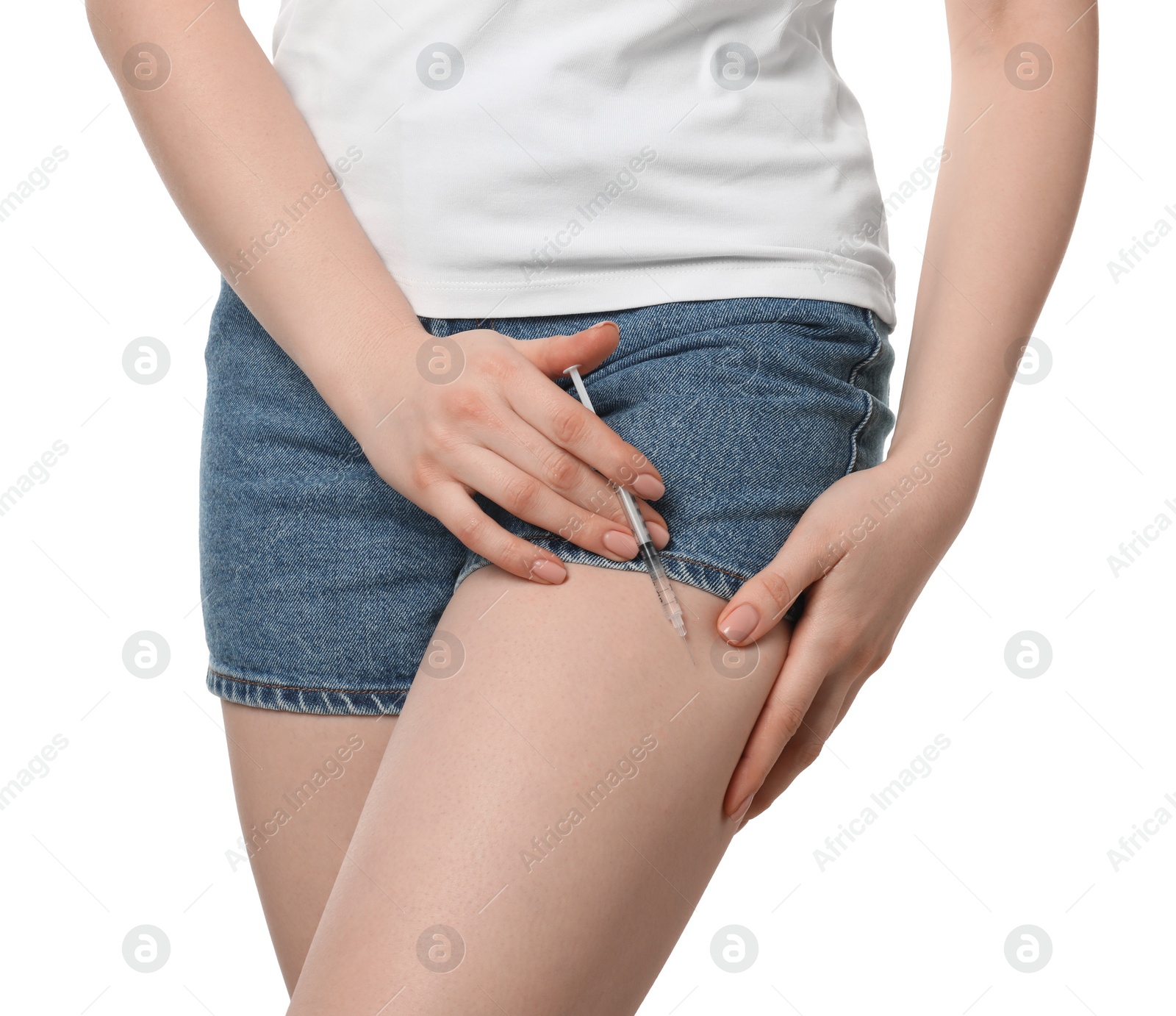 Photo of Diabetes. Woman making insulin injection into her leg on white background, closeup