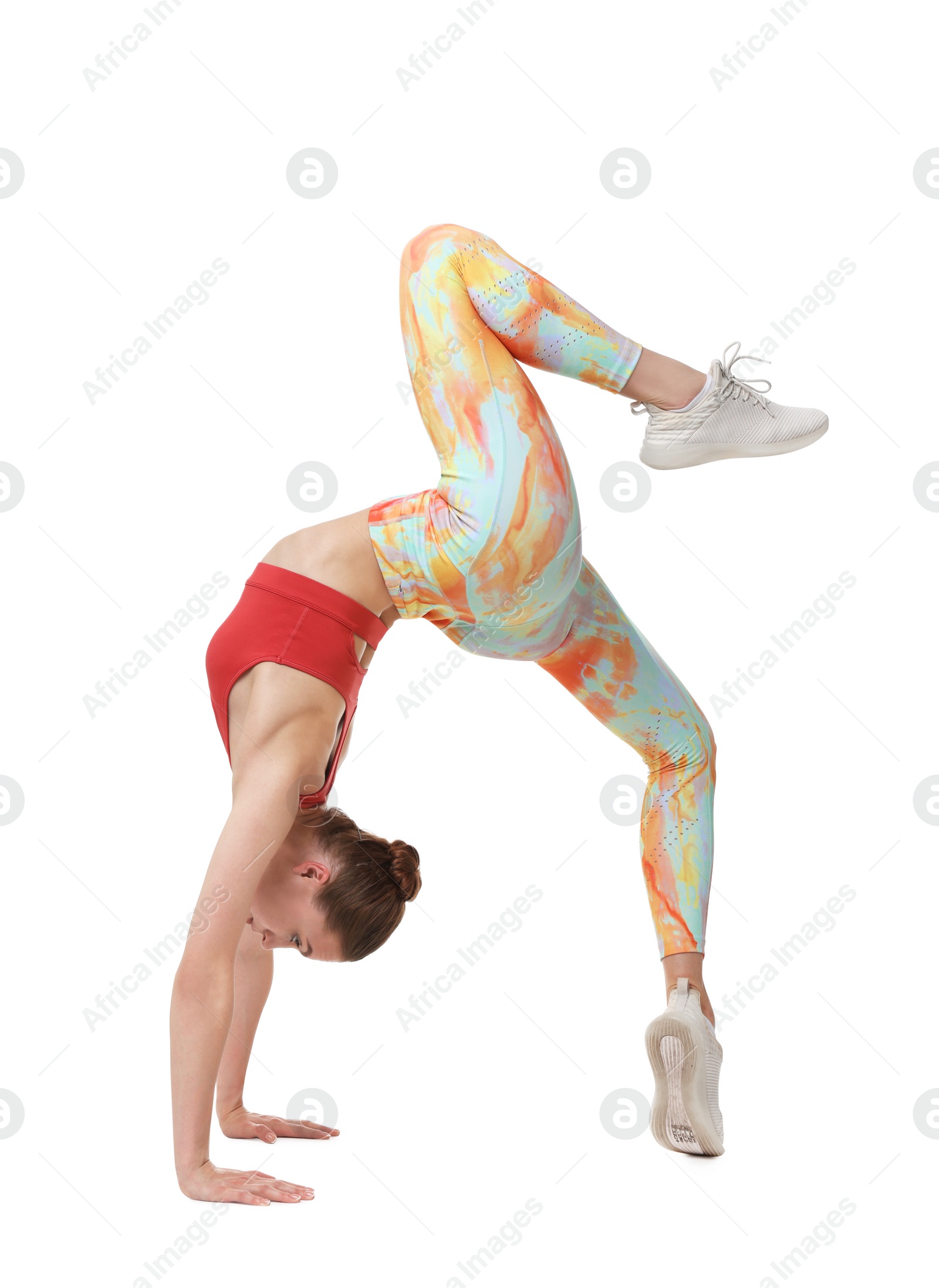 Photo of Yoga workout. Young woman stretching on white background