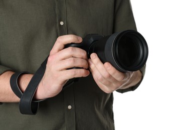 Photo of Photographer holding modern camera on white background, closeup