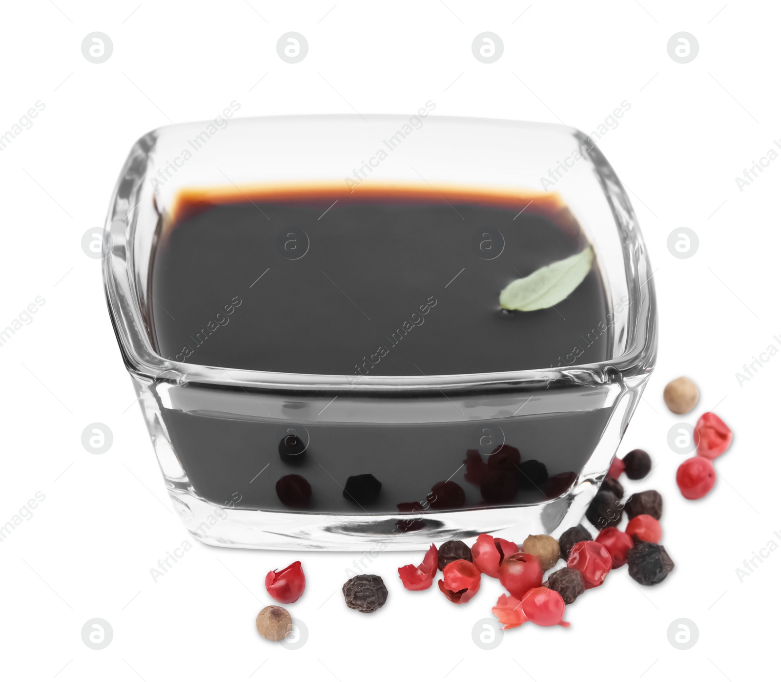 Photo of Organic balsamic vinegar and pepper isolated on white