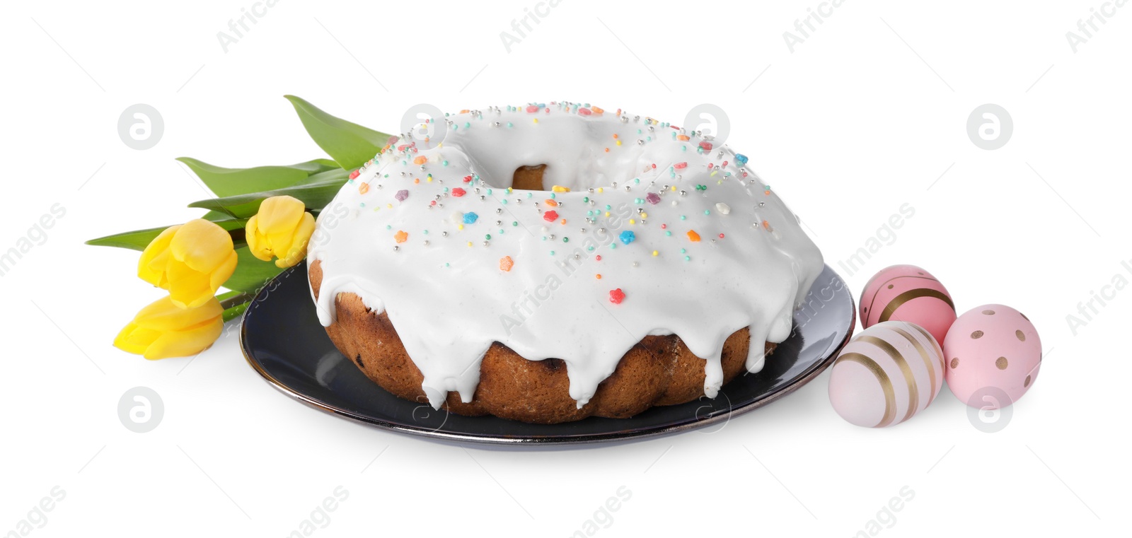 Photo of Easter cake with sprinkles, yellow tulips and decorated eggs isolated on white