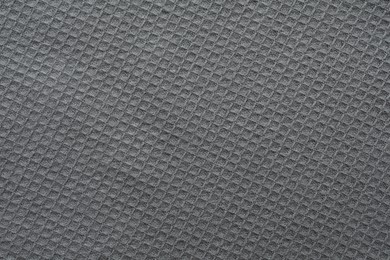 Texture of grey knitted fabric as background, top view