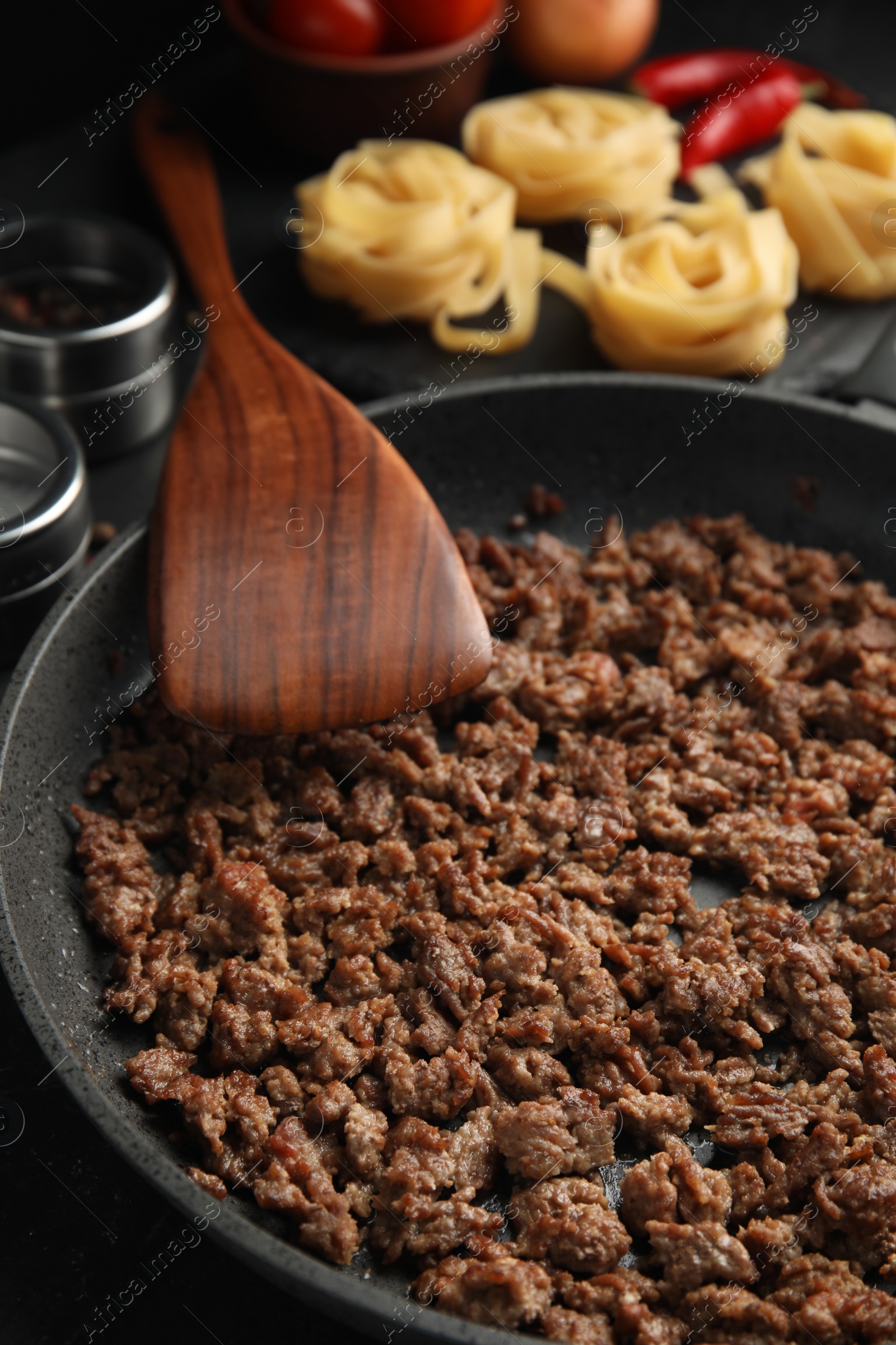 Photo of Fried minced meat on black table, closeup