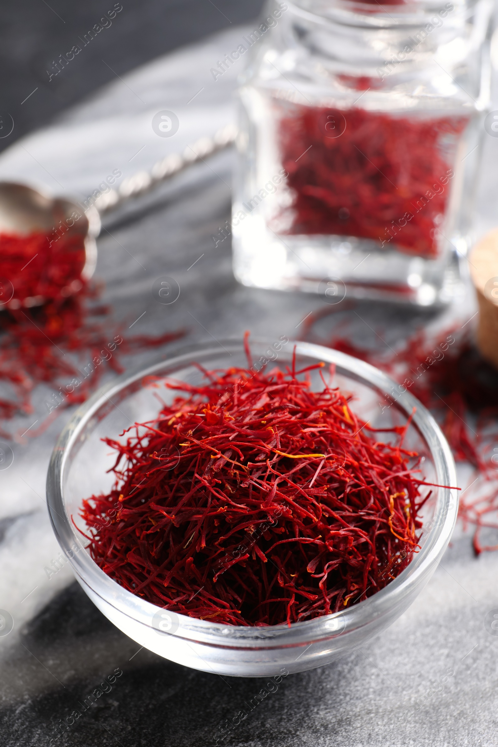 Photo of Dried saffron on grey marble board, closeup