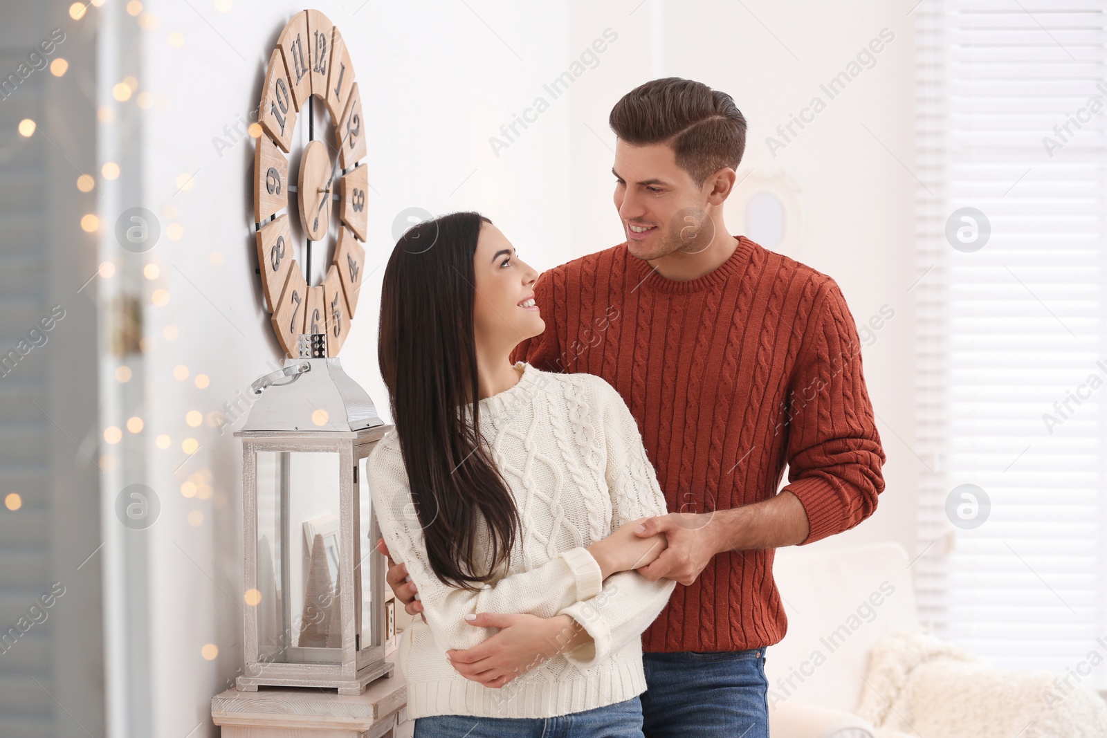 Photo of Happy couple spending time together at home. Winter vacation