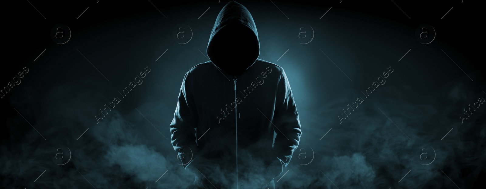 Image of Anonymous man in hood surrounded by smoke on black background. Banner design