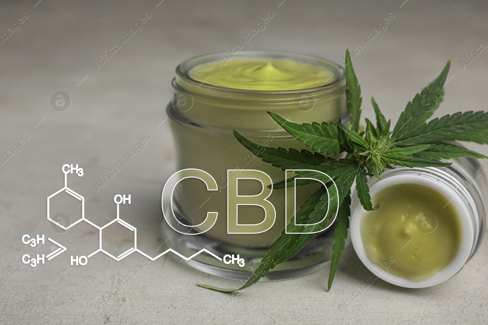 Image of Jars of hemp cream on grey table. CBD formula