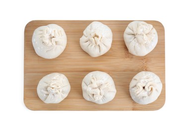 Photo of Board with uncooked khinkali (dumplings) isolated on white, top view. Georgian cuisine