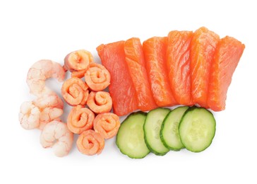Photo of Delicious sashimi set of salmon and shrimps served with cucumbers isolated on white, top view