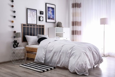 Photo of Modern teenager room interior with comfortable bed