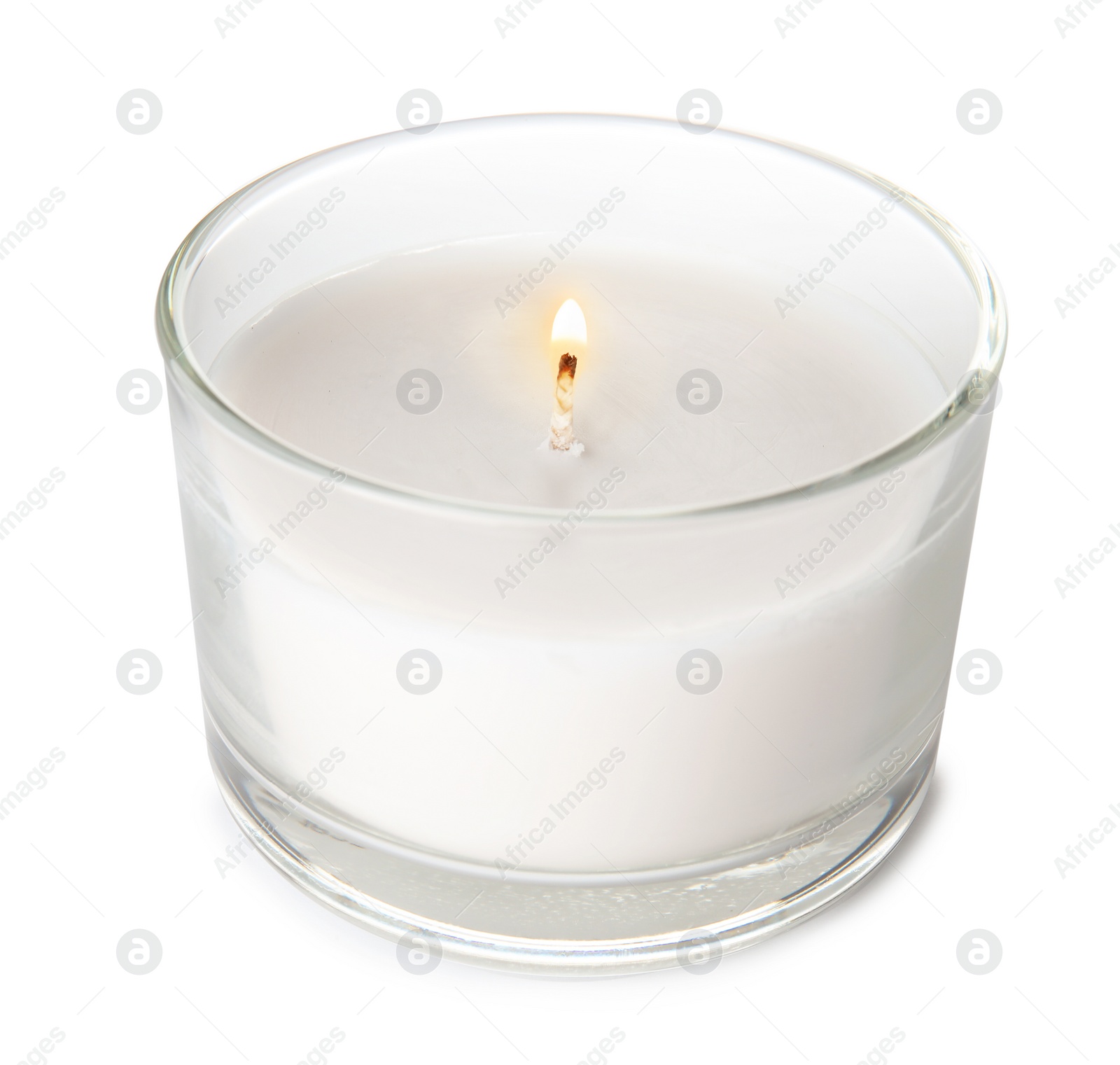 Photo of Burning candle in glass holder on white background