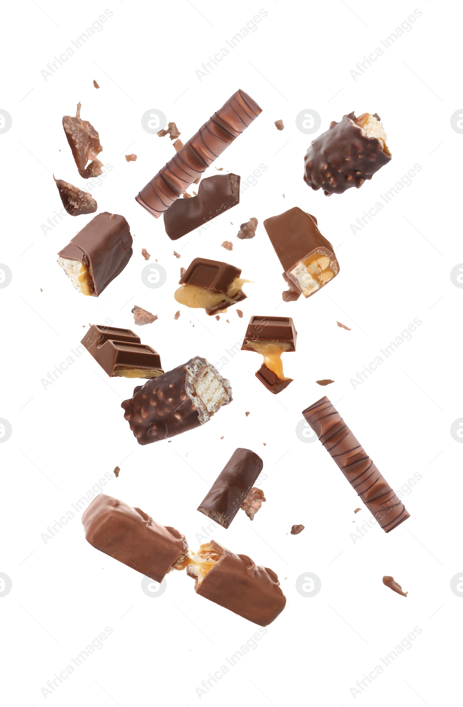 Image of Whole and broken chocolate bars falling on white background