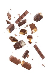 Image of Whole and broken chocolate bars falling on white background