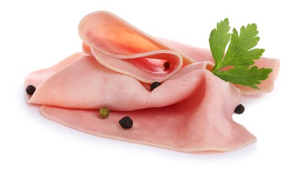 Photo of Delicious ham slices with parsley and peppercorns isolated on white