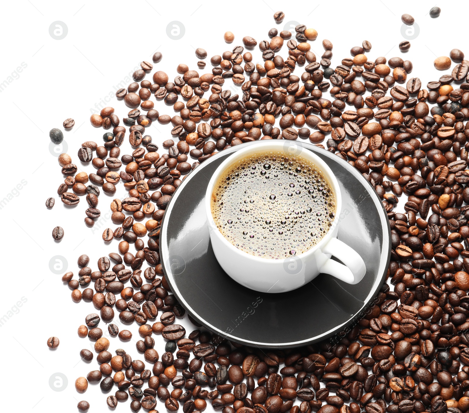 Photo of Roasted coffee beans and cup of hot beverage on white background