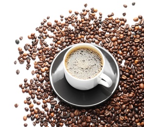 Photo of Roasted coffee beans and cup of hot beverage on white background