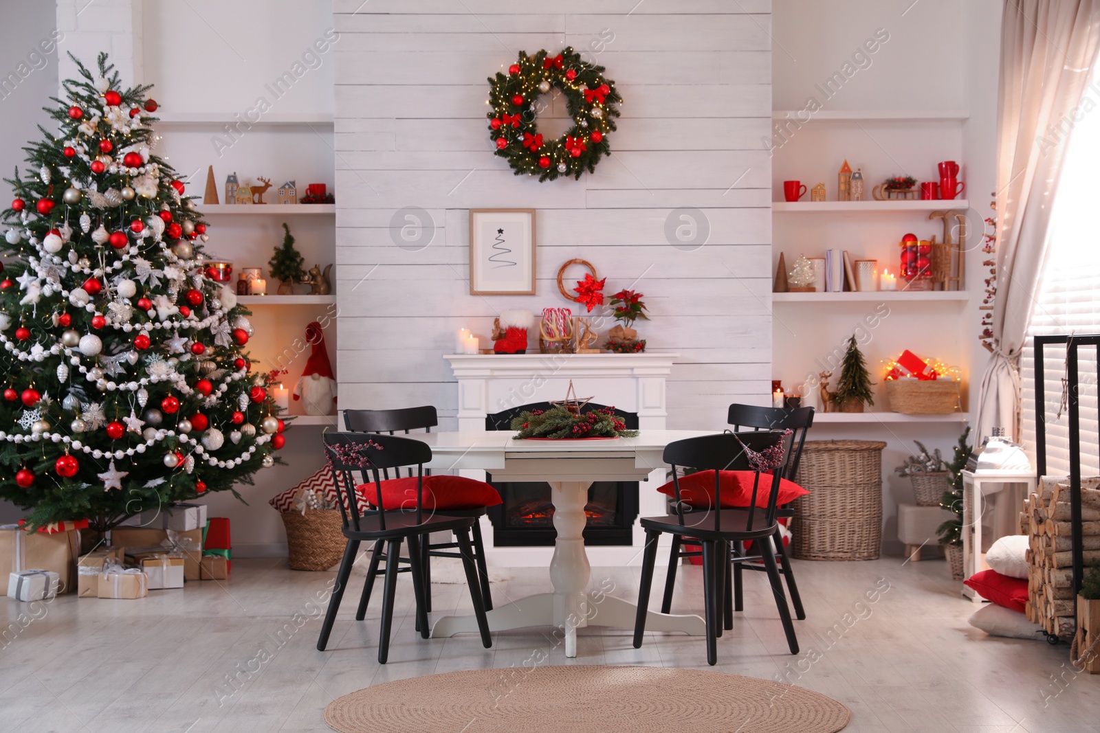 Photo of Cozy dining room interior with Christmas tree and festive decor