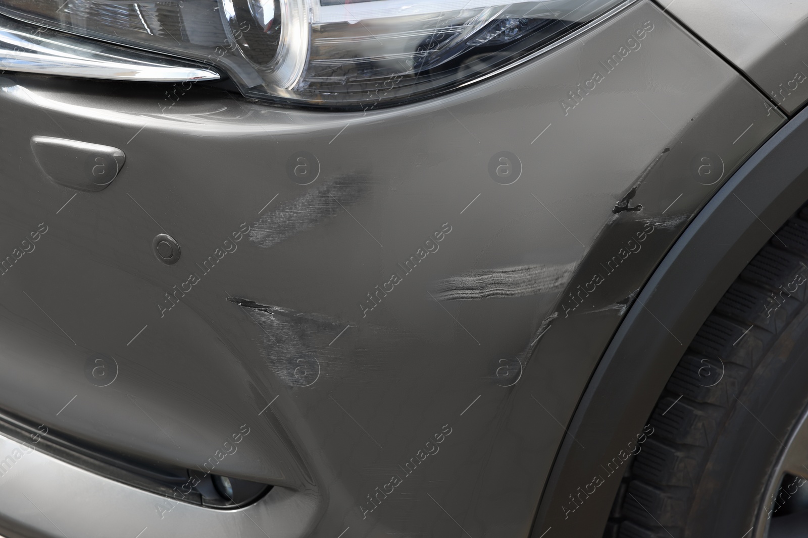 Photo of Modern black car with scratch, closeup view