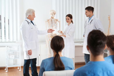 Photo of Medical students having lecture in orthopedics at clinic