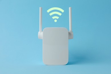 Image of Modern repeater and Wi-Fi symbol on light blue background