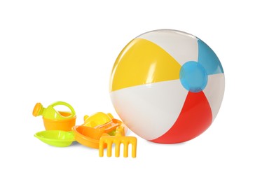 Inflatable colorful beach ball and sand toys on white background