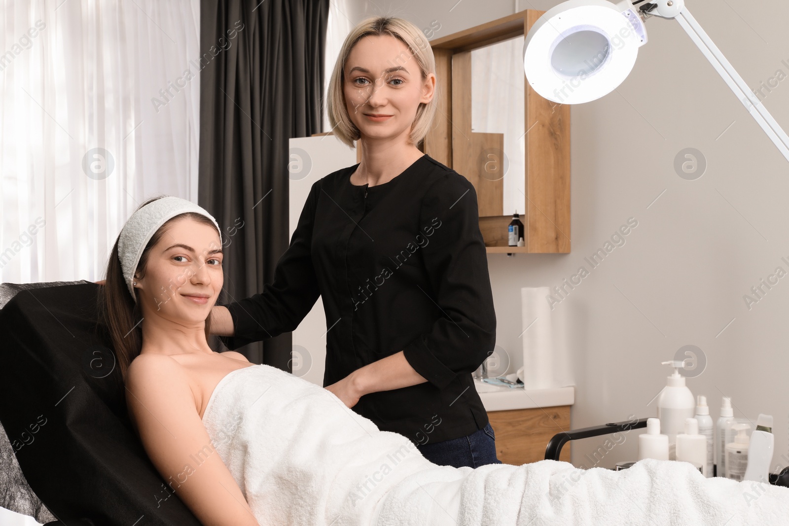 Photo of Portrait of cosmetologist and patient in clinic