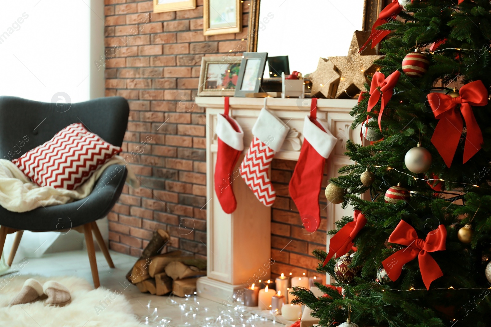 Photo of Room interior with beautiful Christmas tree near decorative fireplace