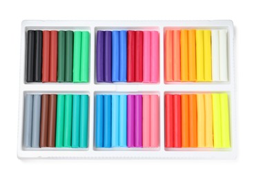 Many different colorful plasticine pieces on white background, top view