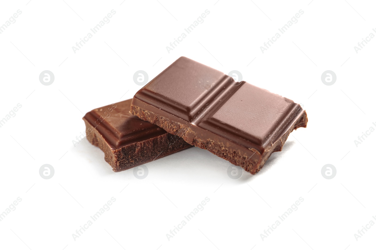 Photo of Pieces of tasty milk chocolate on white background