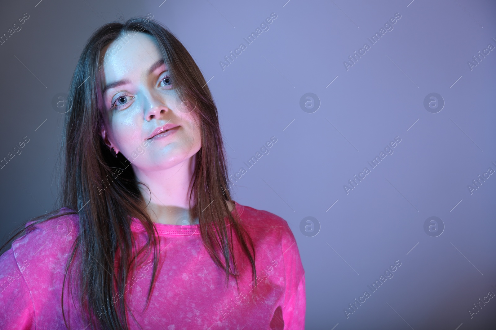 Photo of Portrait of beautiful woman on color background, space for text