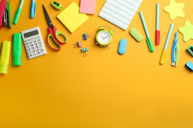 School stationery on yellow background, flat lay with space for text. Back to school