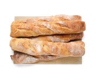 Photo of Crispy French baguettes on white background, top view. Fresh bread