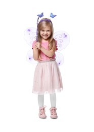 Photo of Cute little girl in fairy costume with violet wings and magic wand on white background