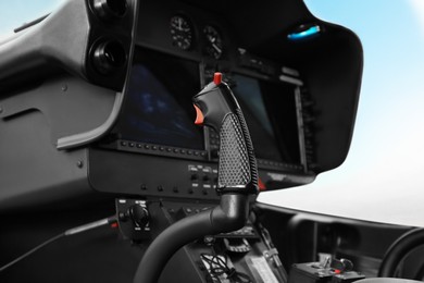 Photo of Helicopter cockpit with new modern functional panel and control lever