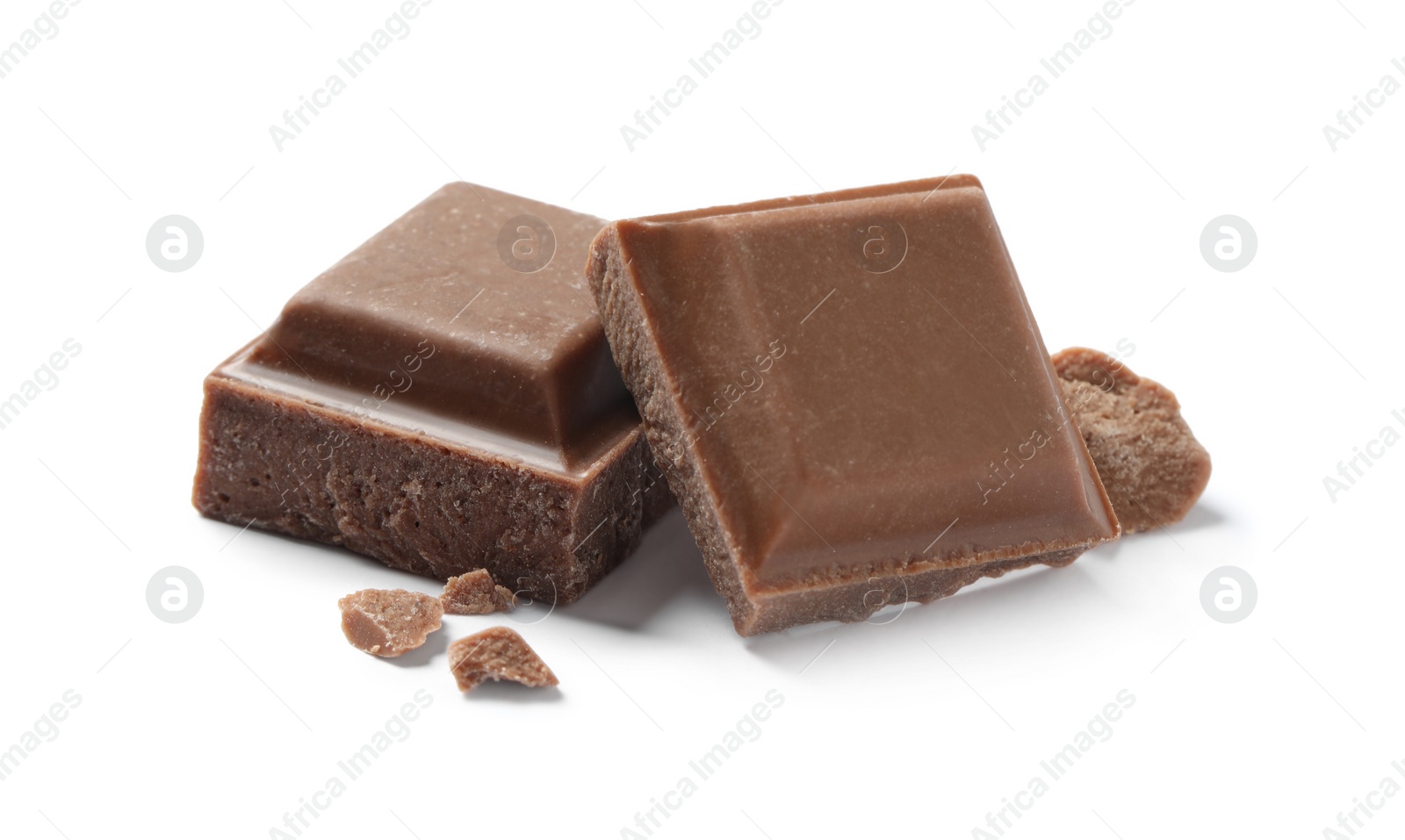 Photo of Pieces of delicious milk chocolate isolated on white