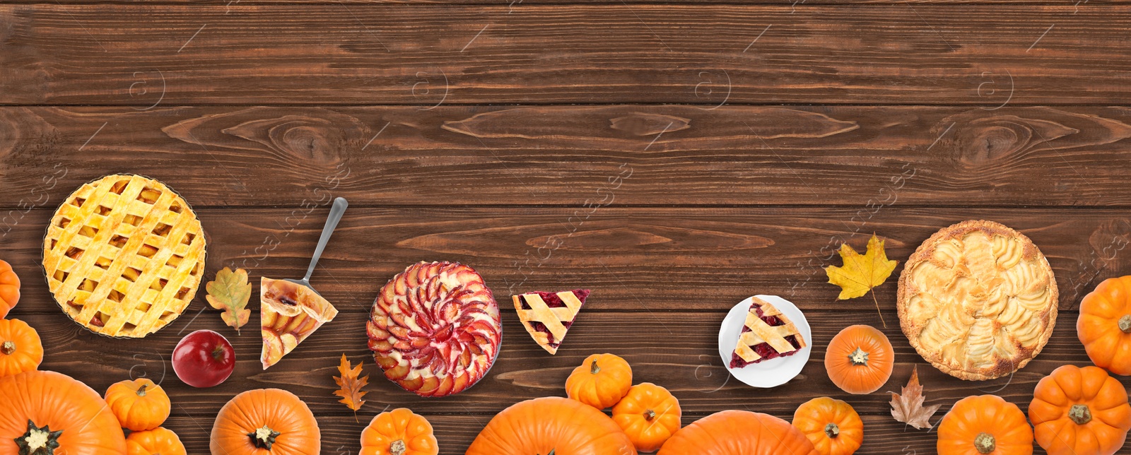 Image of Flat lay composition with different tasty pies on wooden table. Banner design