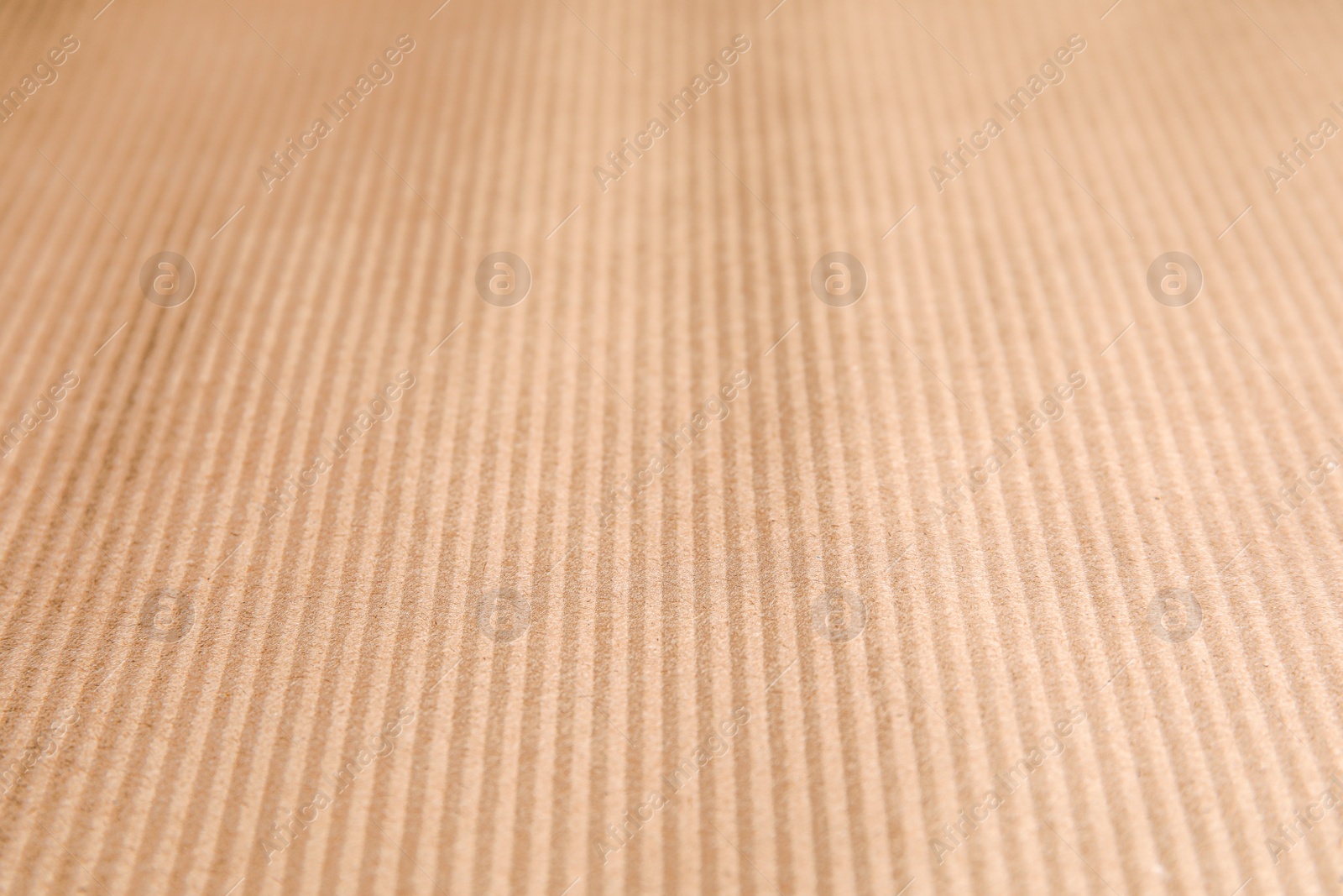 Photo of Brown corrugated sheet of cardboard as background, closeup