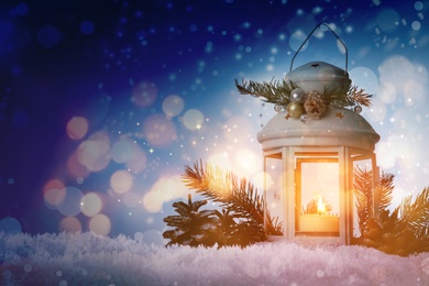 Image of Composition with Christmas lantern on snow, space for text. Magical atmosphere 