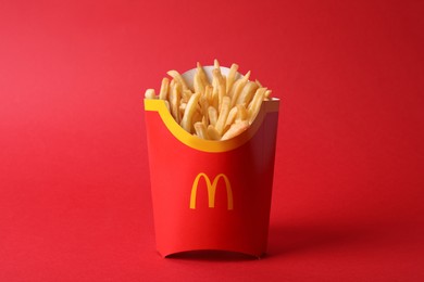 MYKOLAIV, UKRAINE - AUGUST 12, 2021: Big portion of McDonald's French fries on red background