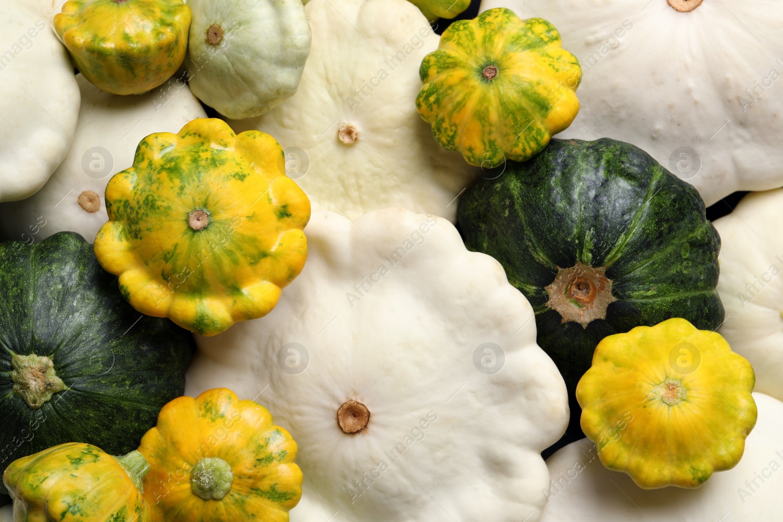 Photo of Fresh ripe pattypan squashes as background, top view