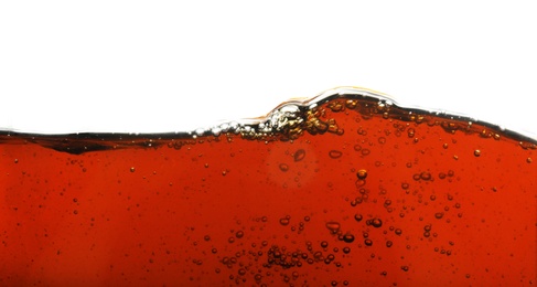 Closeup view of tasty refreshing cola on white background